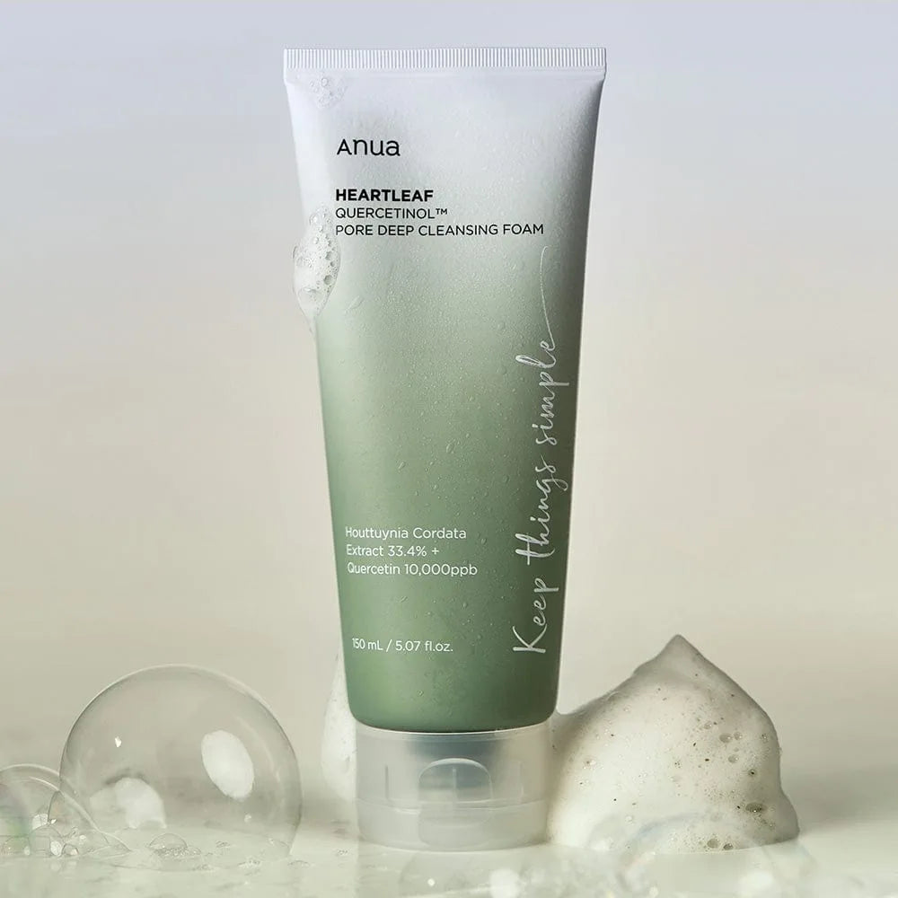 Anua cleansing oil for sensitive skin in green tube with foam and bubbles around, deep pore cleansing foam