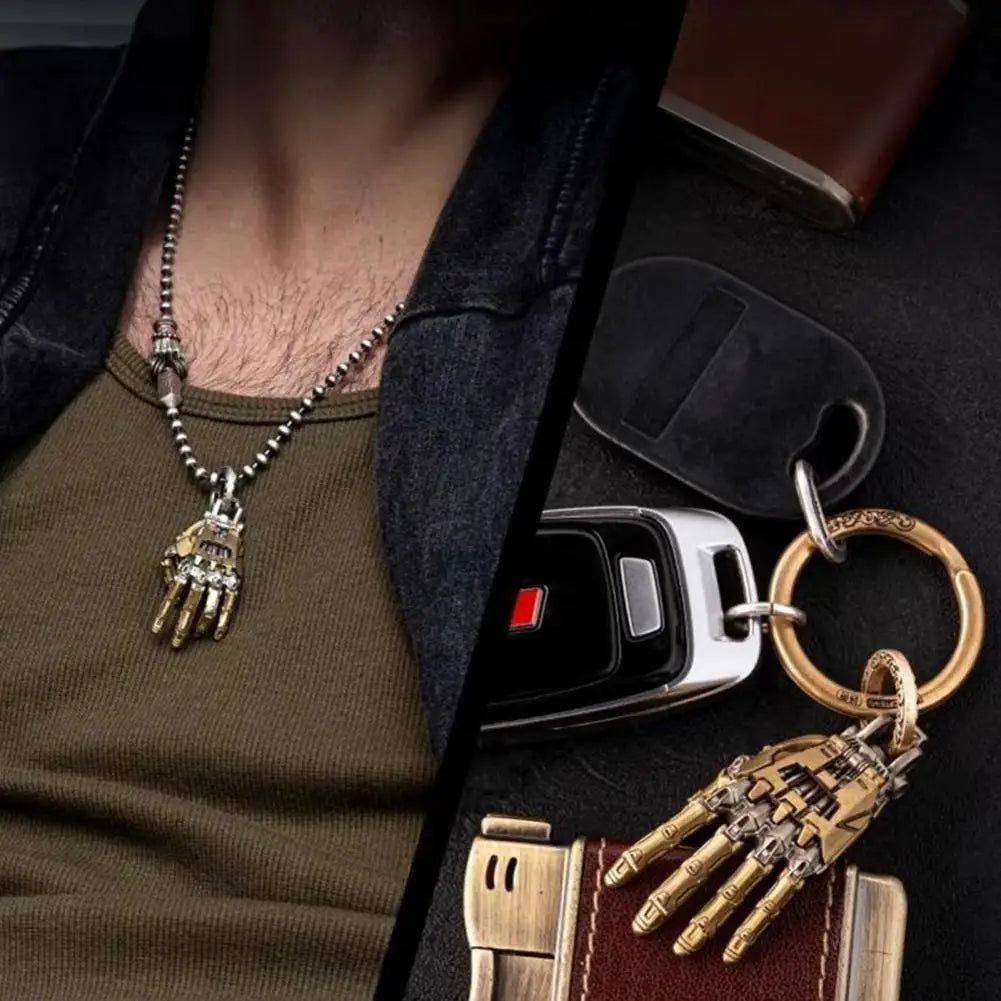 Bionic hand pendant necklace worn on a silver chain and the matching keychain with a mechanical design