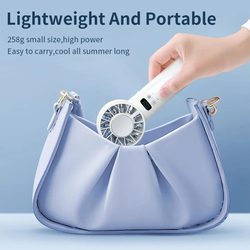 Pluxina ice compress cooling fan being placed into a light purple handbag showing its lightweight and portable design